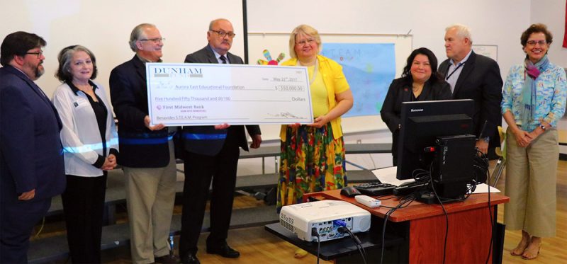 Officials from Dunham Fund present a grant award to District 131 on May 22, 2017.