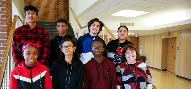 Principal Marina Kosak poses with just a handful of the Tomcats enrolled in AP Capstone classes for the 2019-20 school year.
