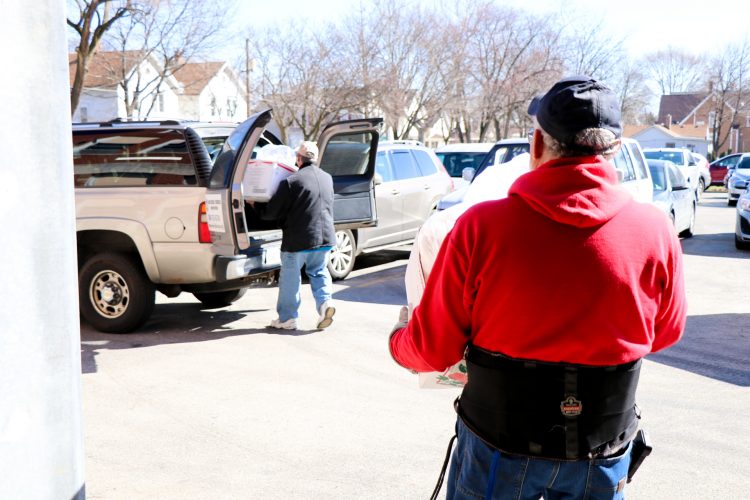 Recovered food is loaded into the Wayside Cross Ministries vehicle. East Aurora’s program helps Wayside feed over 100 men daily.