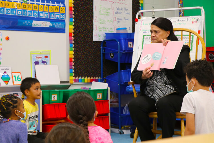 Dr. Ayala reads from the book, I Need a Hug