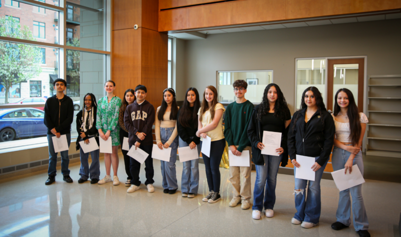 FRMA Poets at the Aurora Public. Library. Pictured from left to right: Marcel Diaz, Kayla Haynes, Hayden Malloy, Kaitlyn Gonzalez, Emmanuel Benigno Cruz, Bella Bustamante, Mariela Ortiz, Sadie Beavers, AJ Fernandez Lopez, Yassel Soto, Valeria Pinedo Gonzalez, Daniela Martinez Rangel