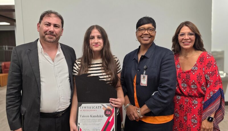 Taleen Kandakji with her family and Cowherd Principal Jackie Gibson