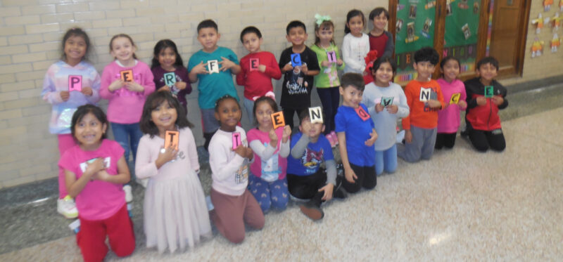 Ms. Wilcoxen's class spells out "Perfect Attendance"