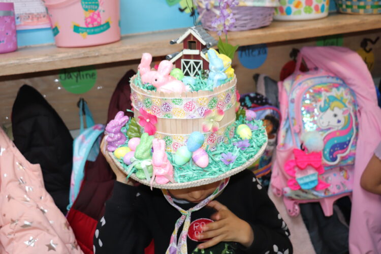 A student shows off their Spring hat.