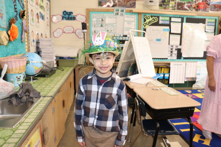 A student shows off their Spring hat.