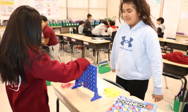 4th grade girls prepare to battle in Connect Four.