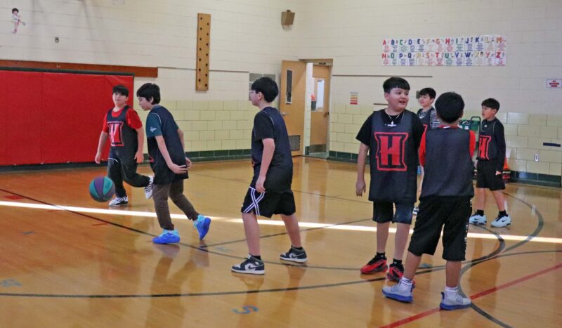 5th grade basketball players warm up before the game.
