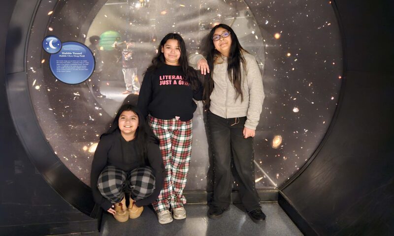 Students check out Adler Planetarium exhibits.