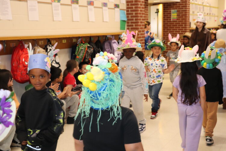 1st Graders parade down the hallway to show off their Spring hats.