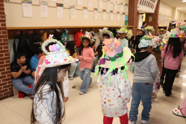 1st Graders parade down the hallway to show off their Spring hats.