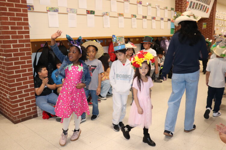 1st Graders parade down the hallway to show off their Spring hats.