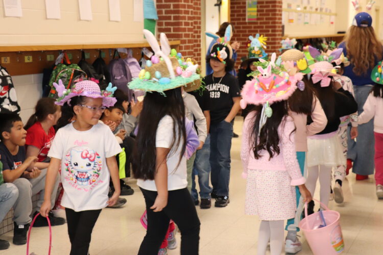1st Graders parade down the hallway to show off their Spring hats.