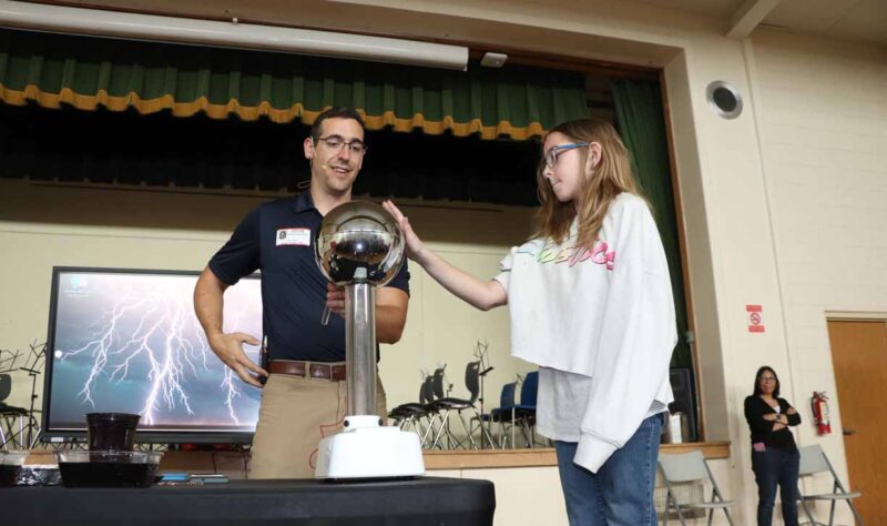 Addyson Herrington bravely helps with a lightning demonstration!