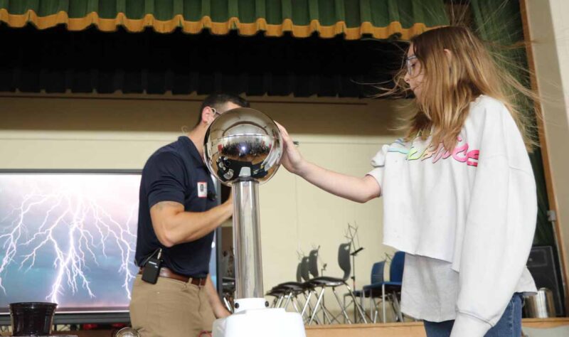 Addyson Herrington bravely helps with a lightning demonstration!