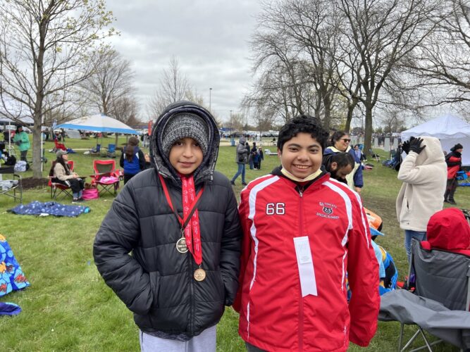 Juan and Julian trying to stay warm and ready for their next event